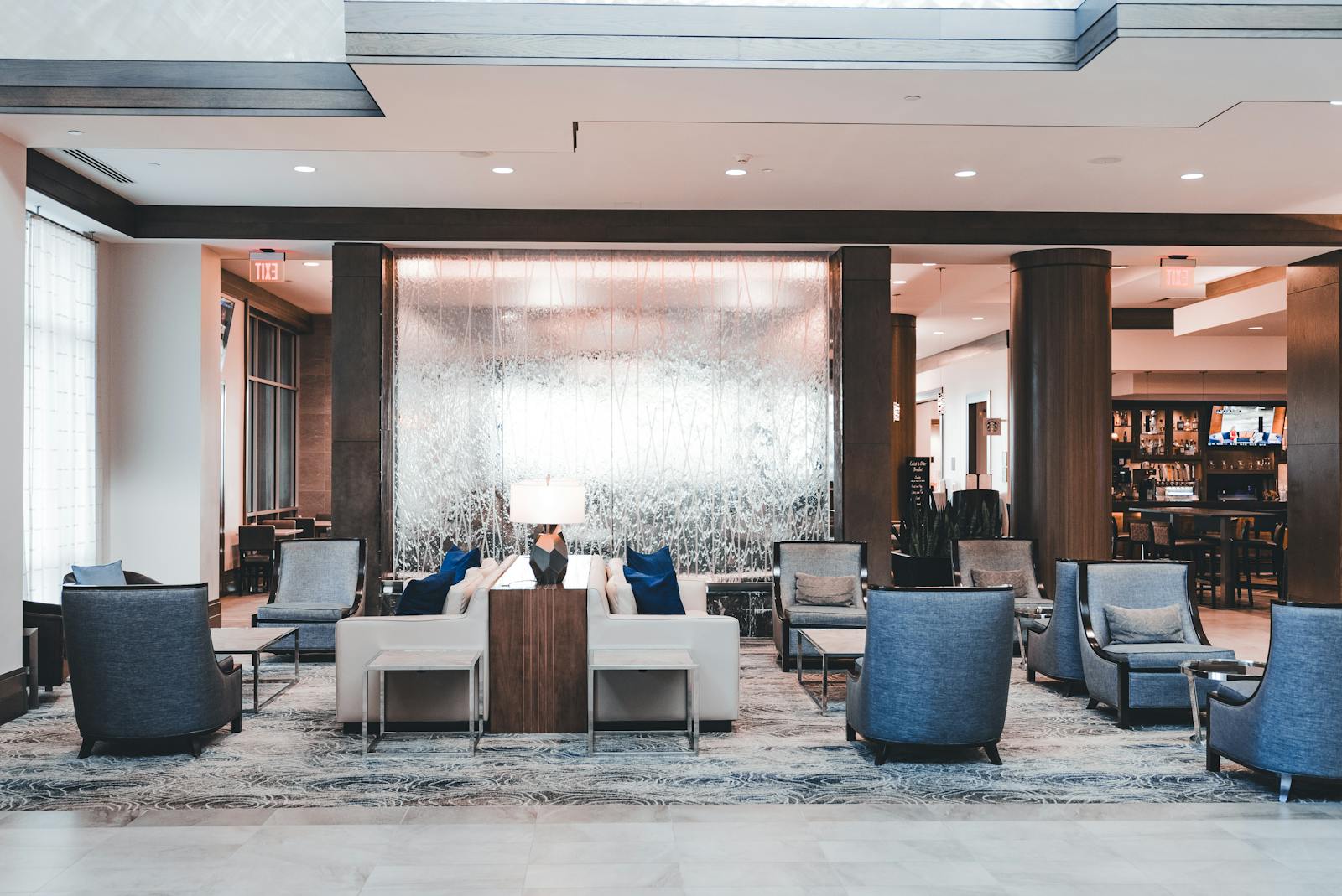 A bright, contemporary upscale residential lobby with seating